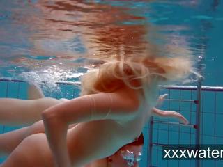 Milana and Katrin strip eachother underwater