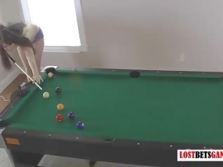 Two fascinating brunettes play a game of strip billiards