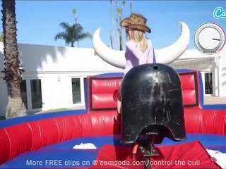 Provocative girls ride bull