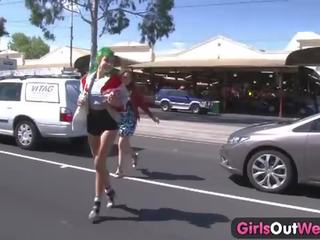 Two randy lesbians enjoying dirty film on the street