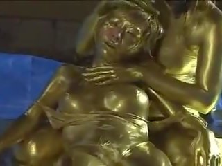 Queen tortures gold painted slave